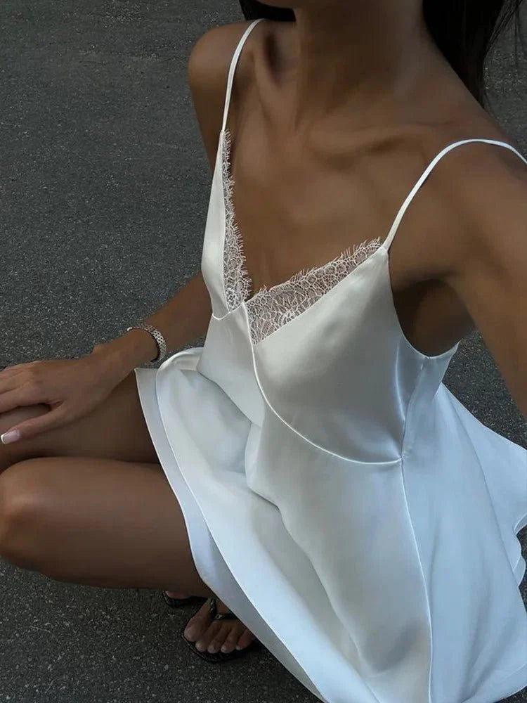 Women's mini dress with lace trim and spaghetti straps