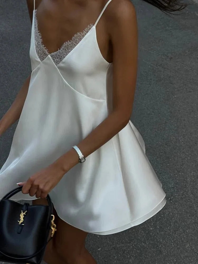 Women's mini dress with lace trim and spaghetti straps